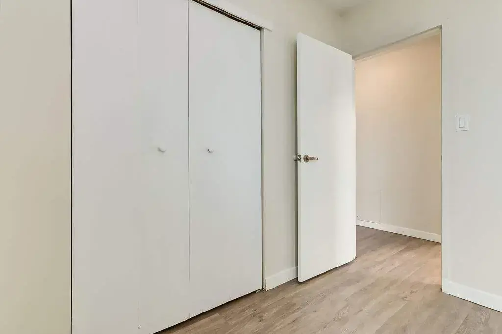 Open bedroom space with flexible layout at Hyland Manor in Bonnyville.