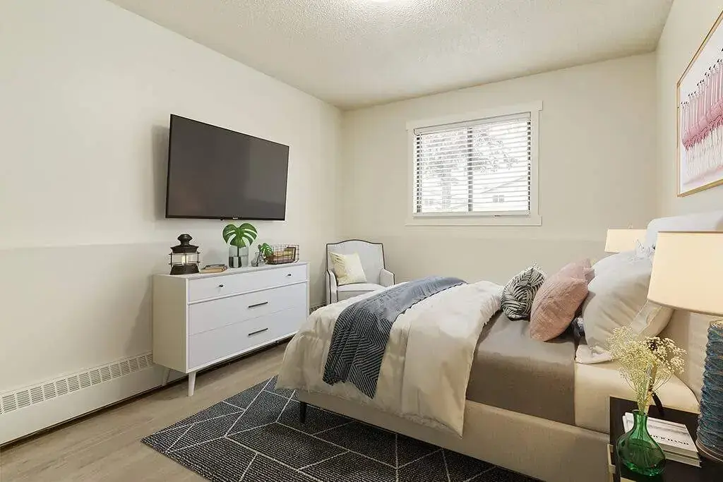Open bedroom space with flexible layout at King Art in Bonnyville.