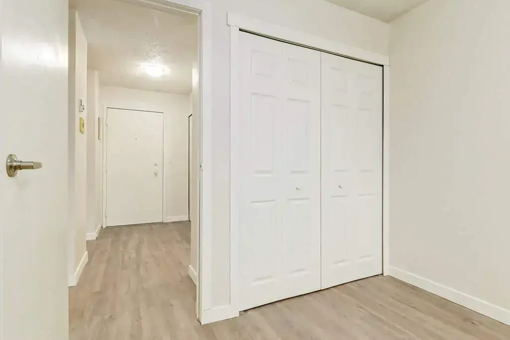 Open bedroom space with flexible layout at King Art in Bonnyville.
