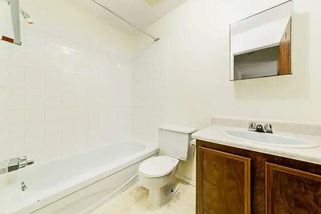Comfortable full bathroom with tub and shower at King Art in Bonnyville.