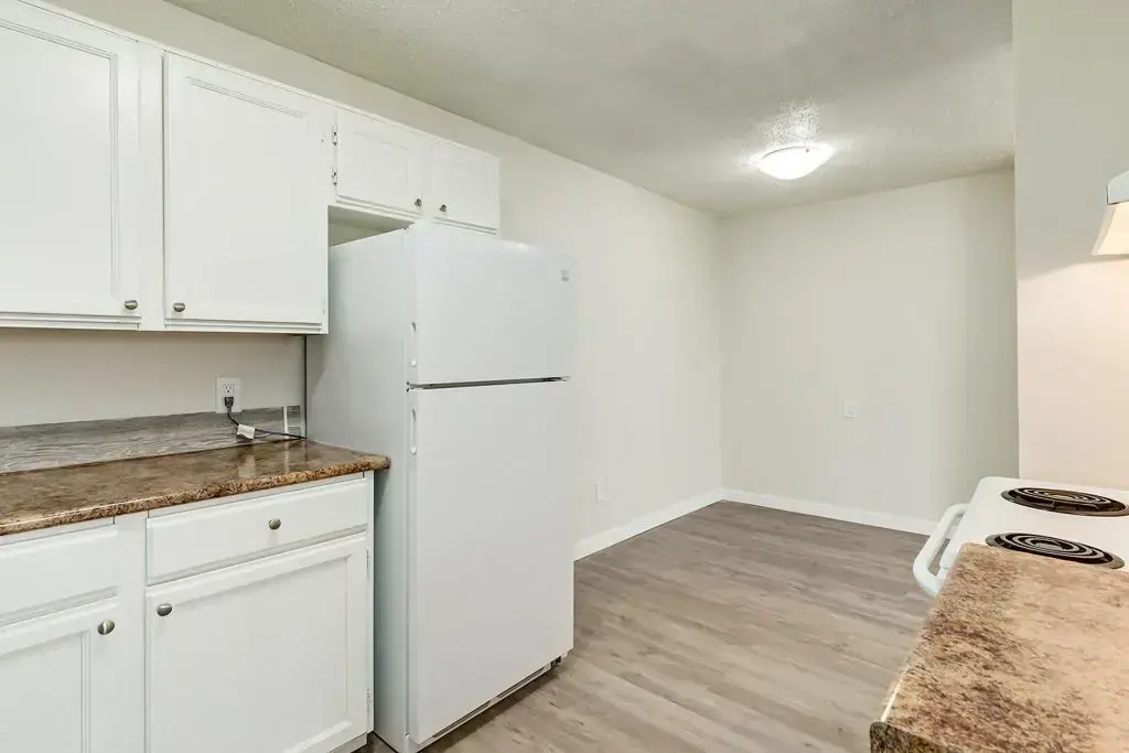 Galley style kitchen connected to dining area at Matichuk in Bonnyville.