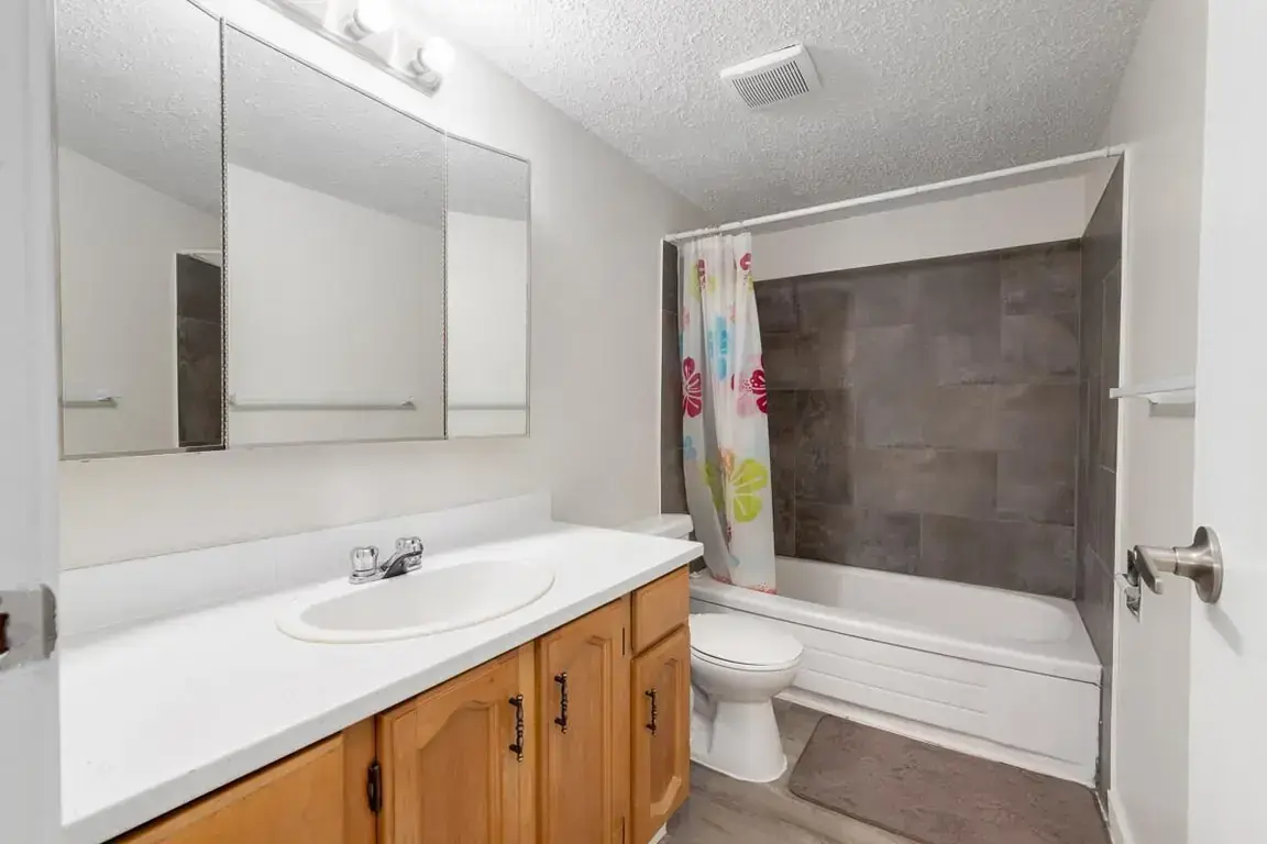 Apartment bathroom with tub and shower at Matichuk in Bonnyville.