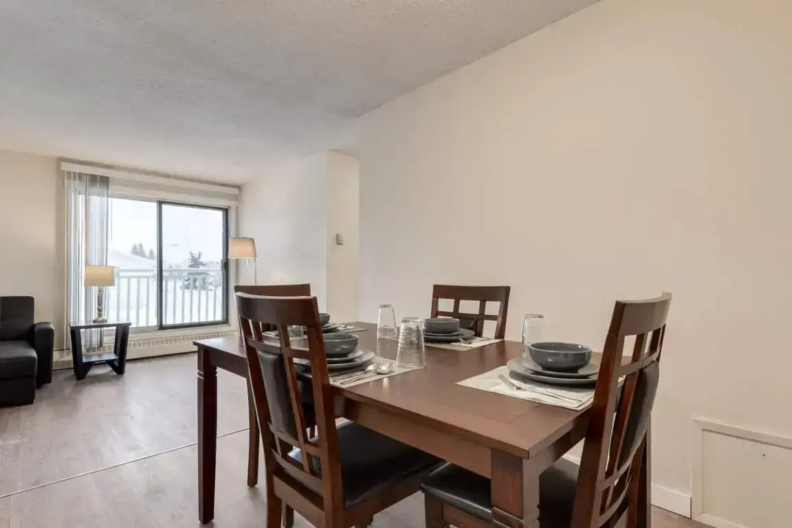 Open living room space and dining area at Matichuk in Bonnyville.