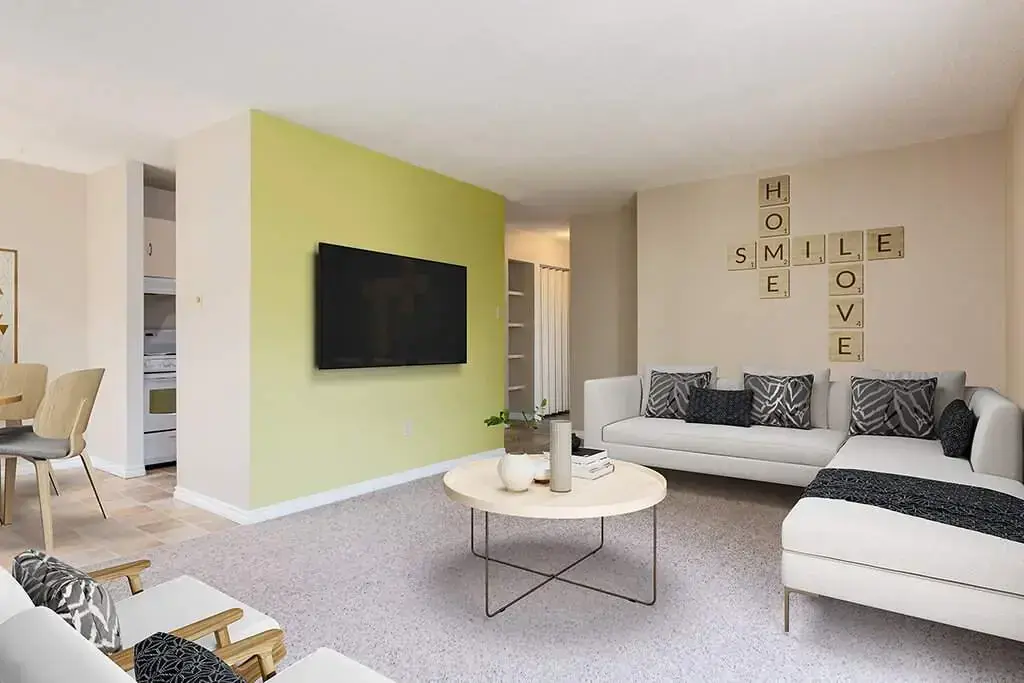 Sunlit living room with large windows at Lamplighter in Camrose.