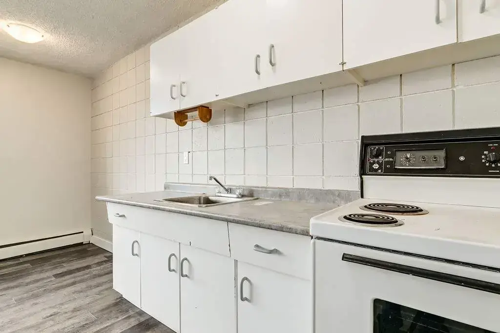 Functional kitchen and dining corner at Cloverdale Apartments in Edmonton.
