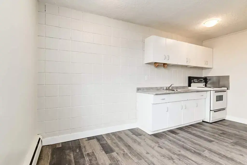 Kitchen and dining area at Cloverdale Apartments in Edmonton.