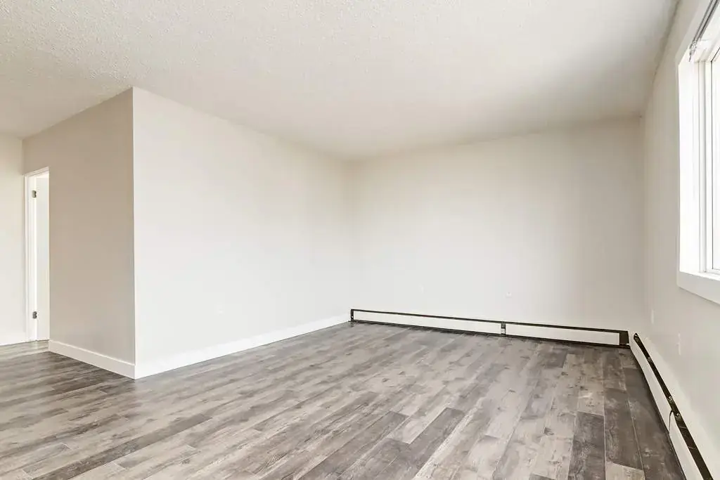 Inviting living room space at Cloverdale Apartments in Edmonton.