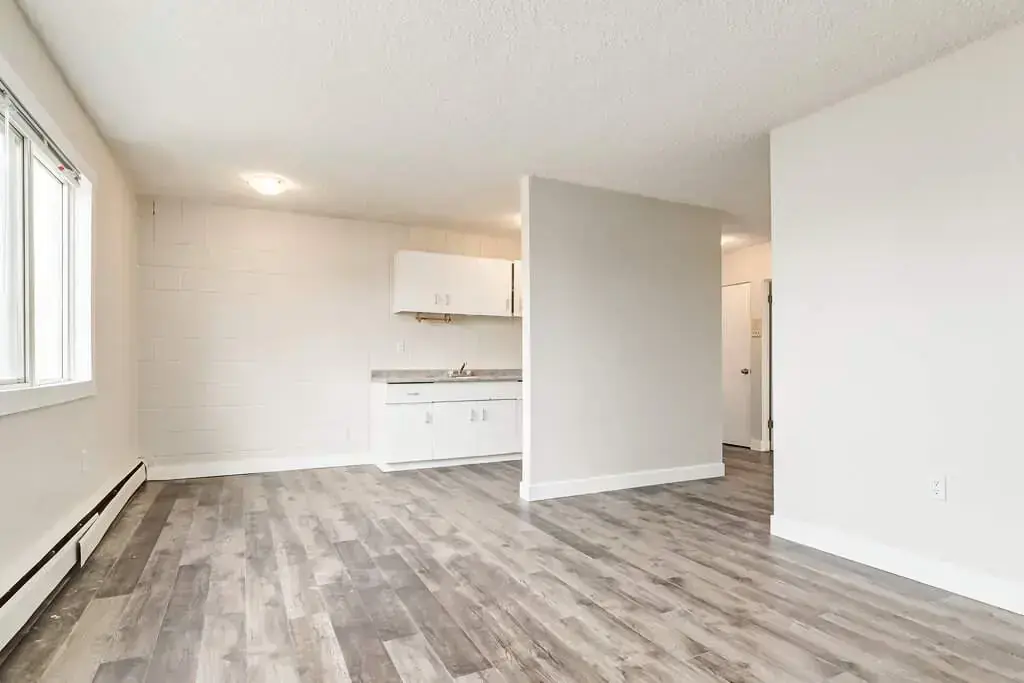 Open living room space at Cloverdale Apartments in Edmonton.