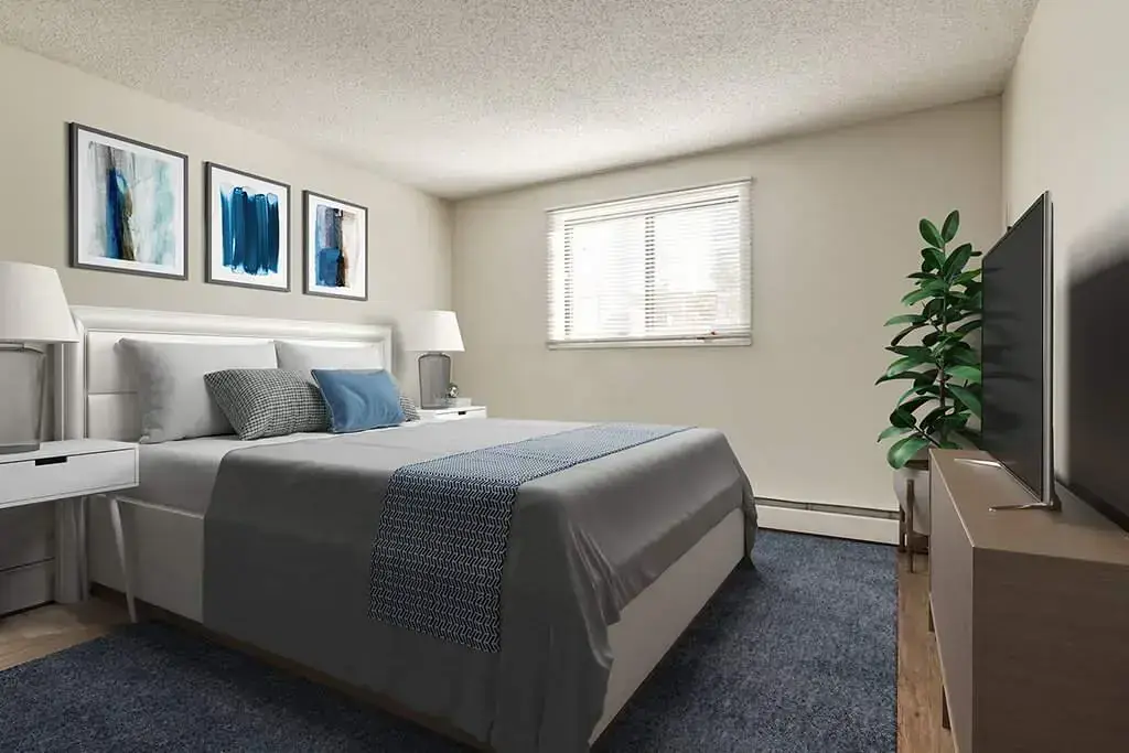 Comfortable and well-sized bedroom at Hudson Court in Edmonton.
