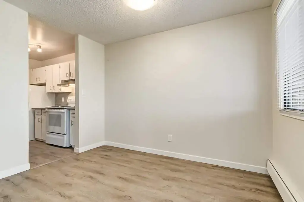 Dining area and access to the kitchen at Hudson Court in Edmonton.