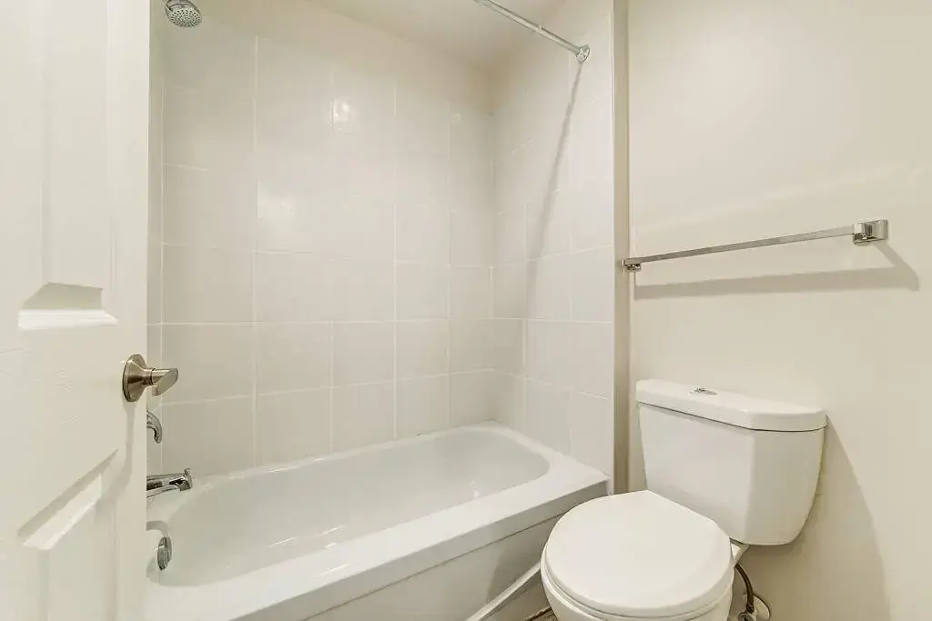 Clean full bathroom with tub and shower at Hudson Court in Edmonton.