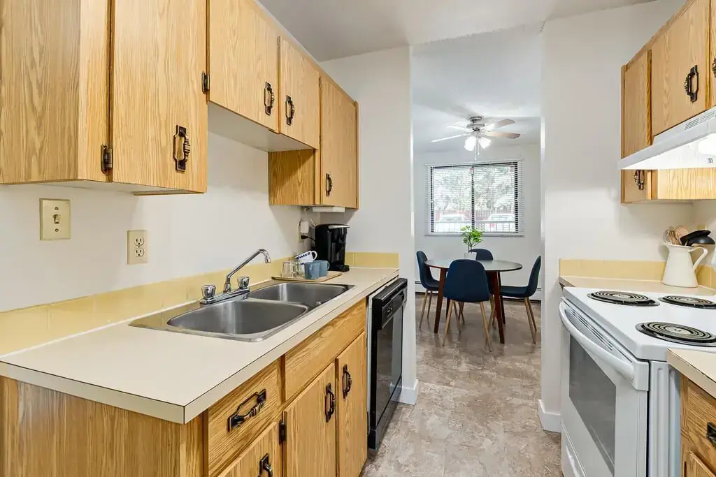Galley style kitchen and dining area at Hudson Court in Edmonton.
