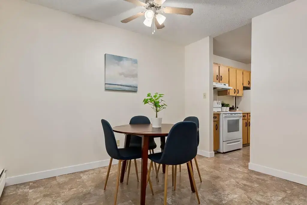 Dining area with natural light at Hudson Court in Edmonton.