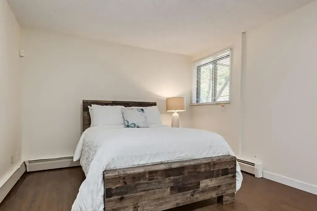 Open bedroom space with flexible layout at Hudson Court in Edmonton.