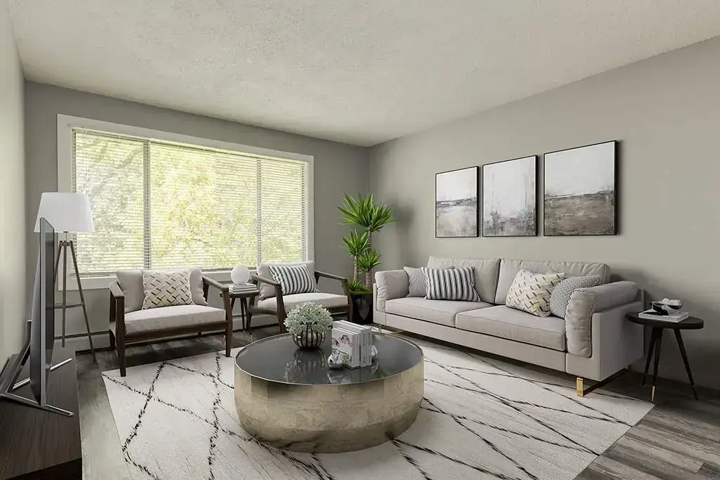 Living room with large windows and natural light at Lenita Manor in Edmonton.