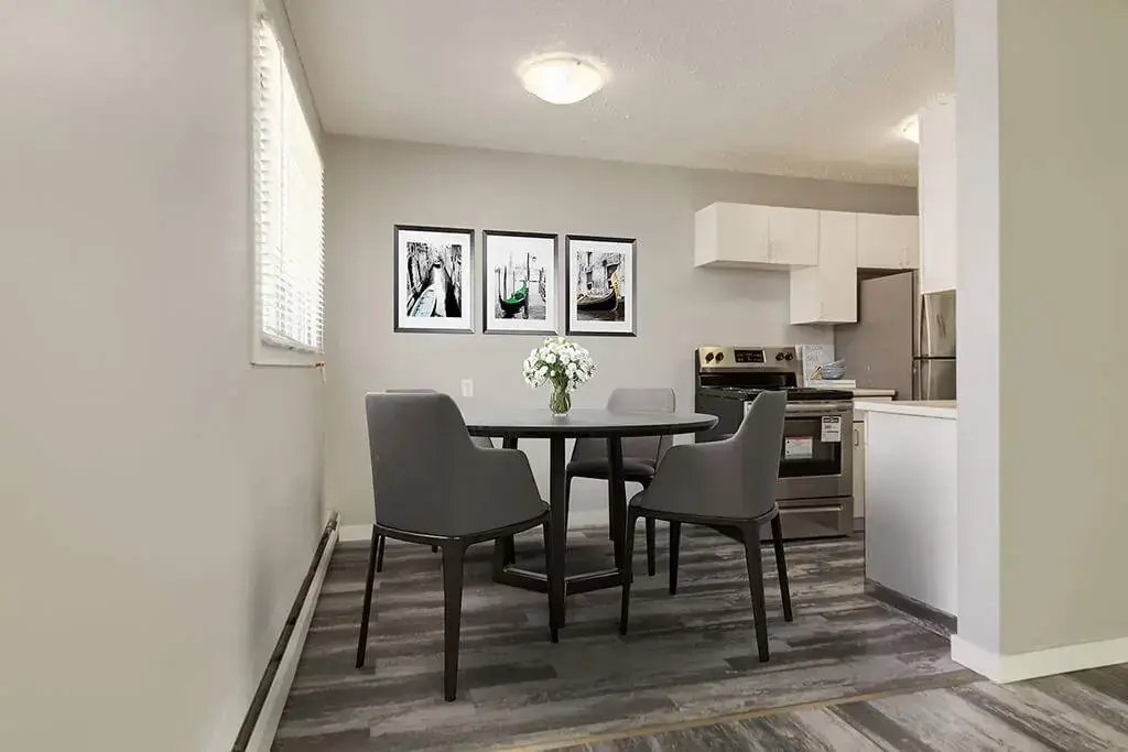 Dining area with natural light at Lenita Manor in Edmonton.