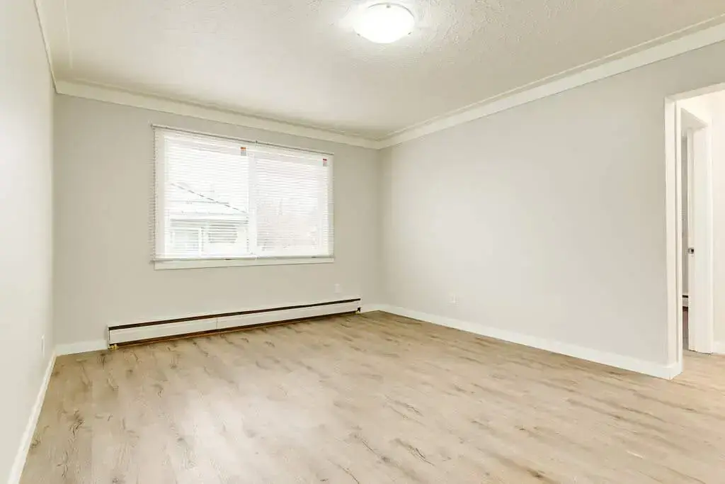 Comfortable and well-sized bedroom at Phelips Apartments in Edmonton.