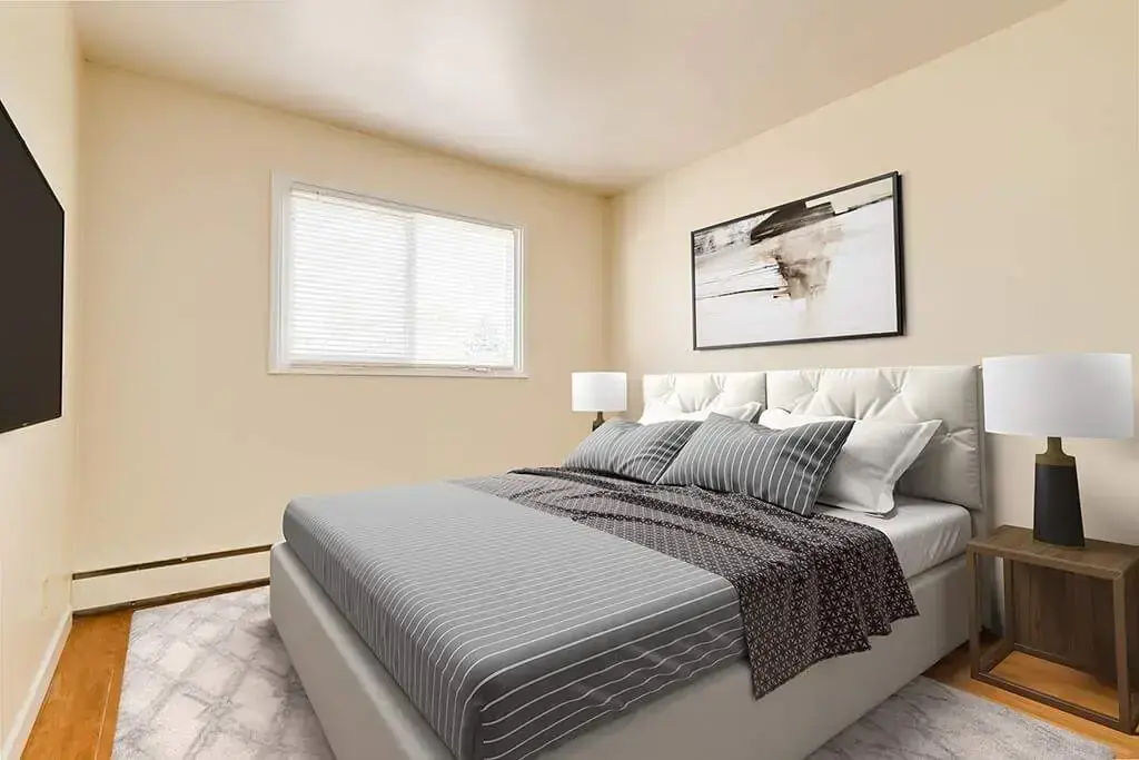 Comfortable and well-sized bedroom at Skyview Apartments in Edmonton.
