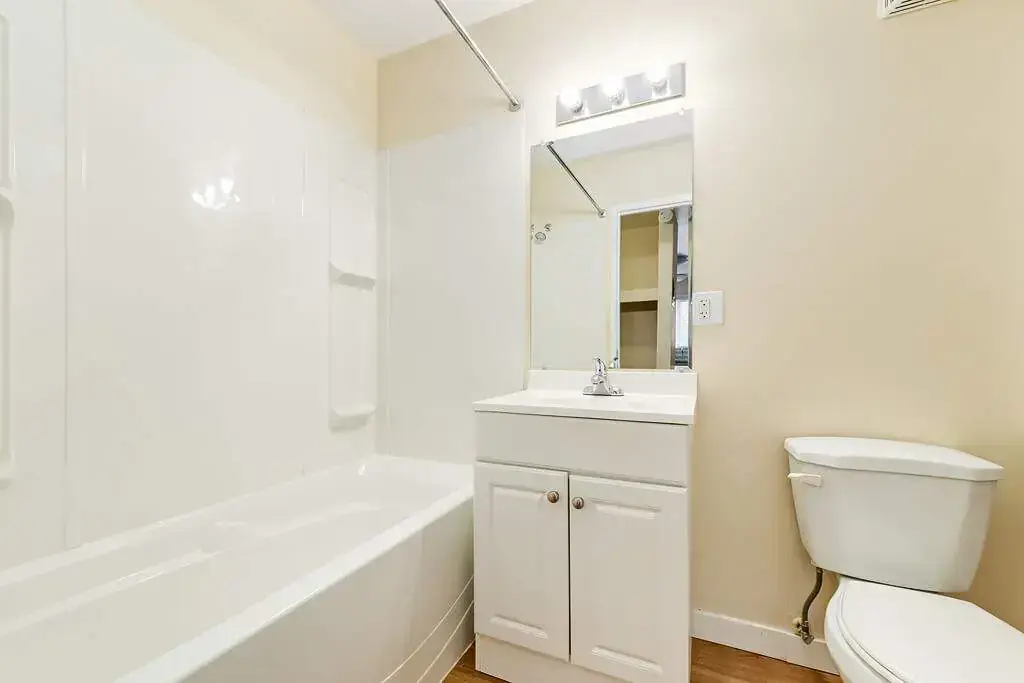 Apartment bathroom with tub and shower at Skyview Apartments in Edmonton.