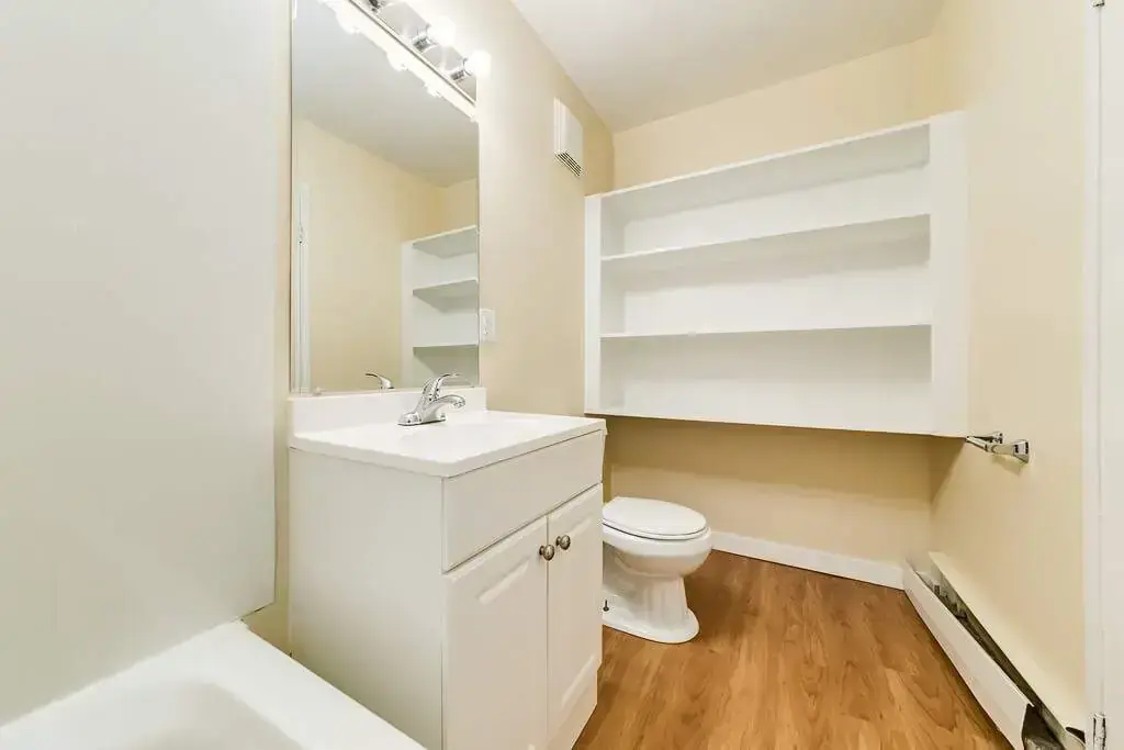 Comfortable full bathroom with tub and shower at Skyview Apartments in Edmonton.