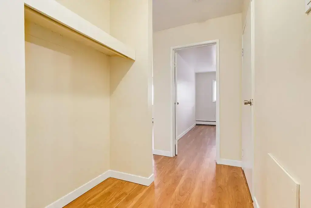 Entryway with good size open closet space at Skyview Apartments in Edmonton.