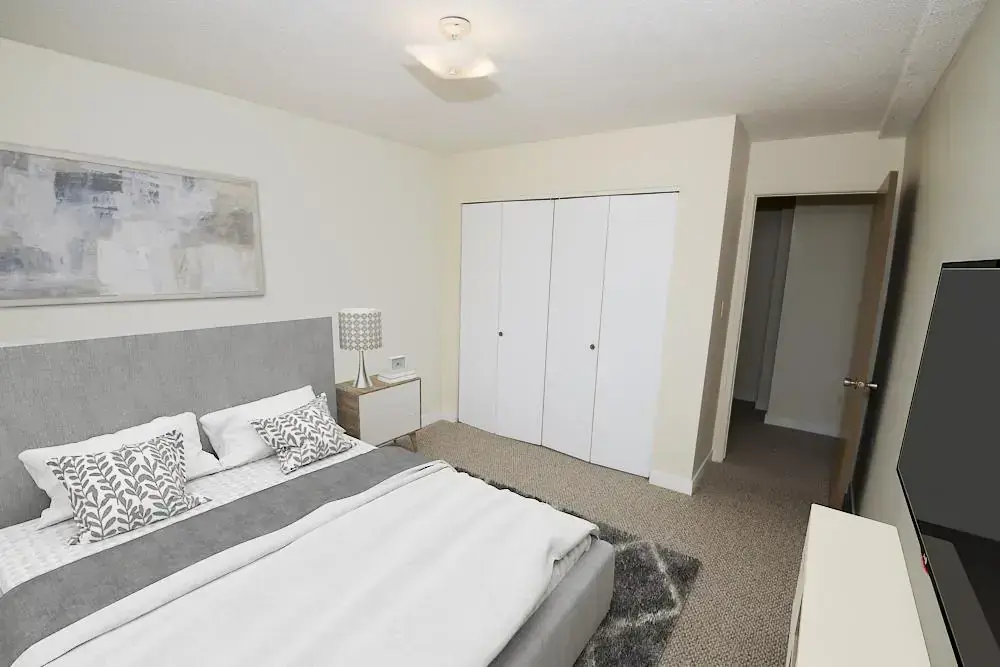 Open bedroom space with flexible layout at South Ridge Apartments in Edmonton.