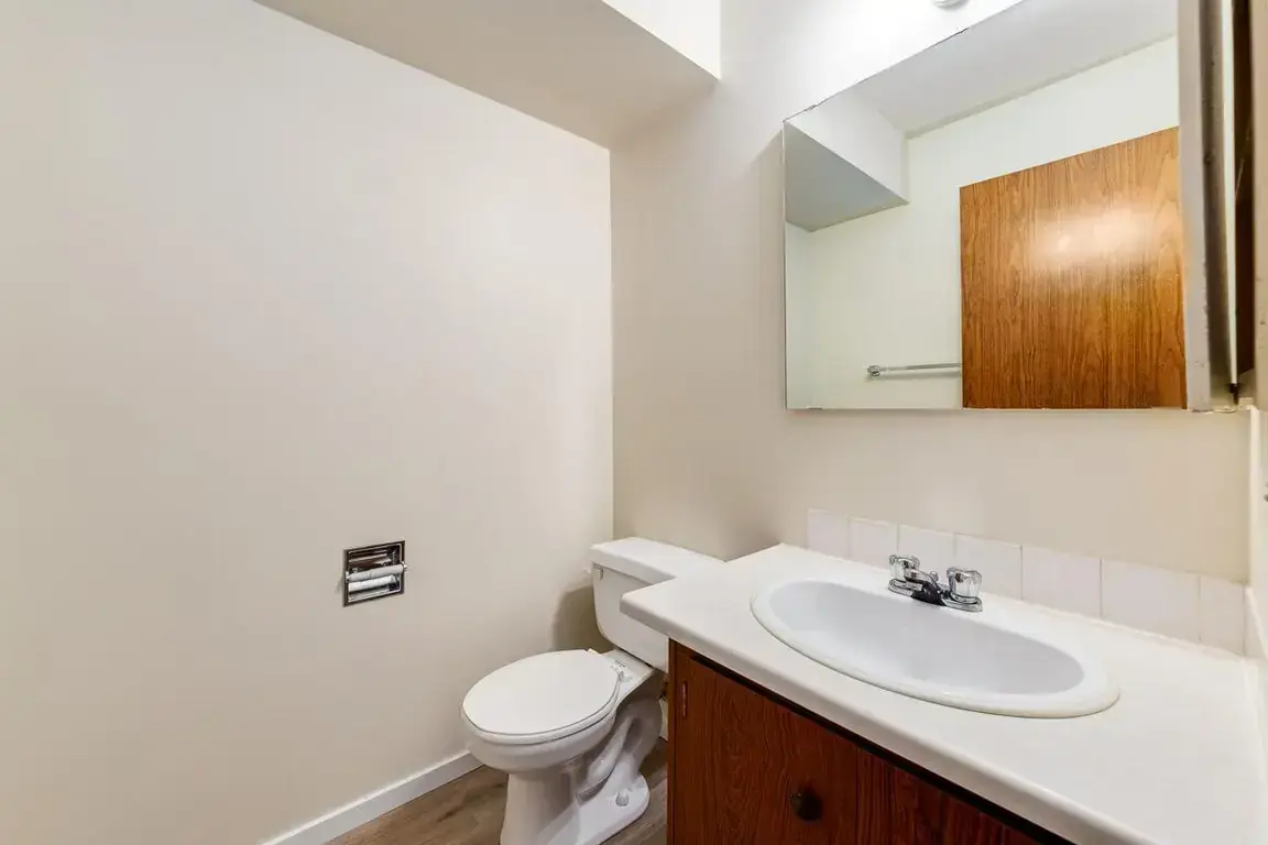 Functional full bathroom with tub and shower at South Ridge Apartments in Edmonton.