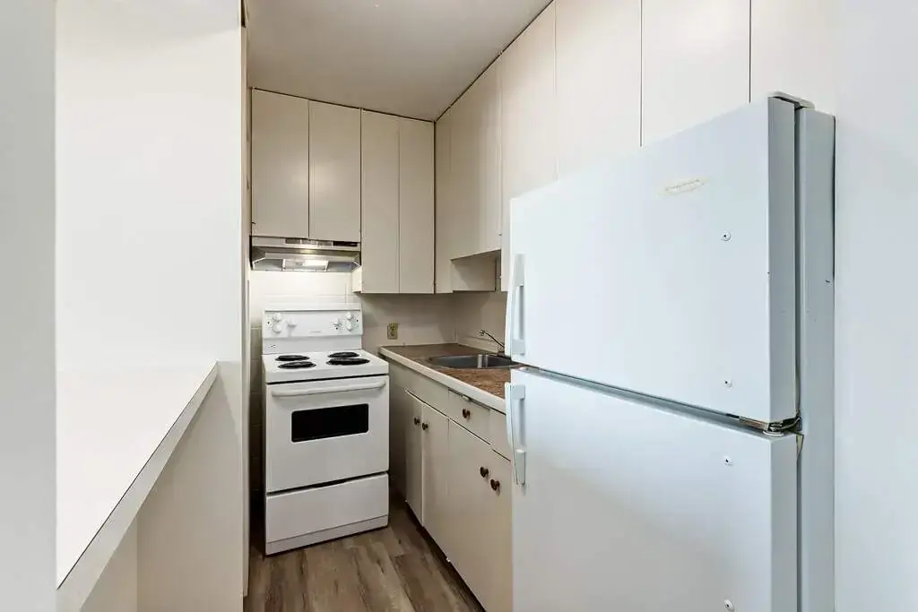 Compact kitchen at Applewood apartments in Lethbridge.