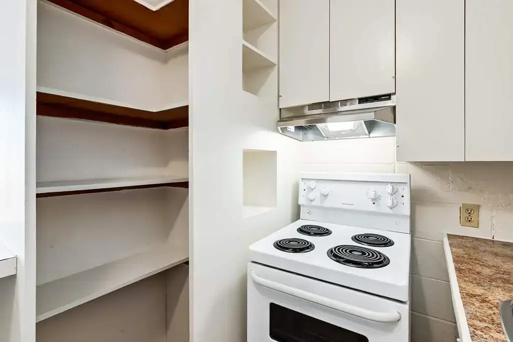 Cozy kitchen with functional pantry at Applewood in Lethbridge.