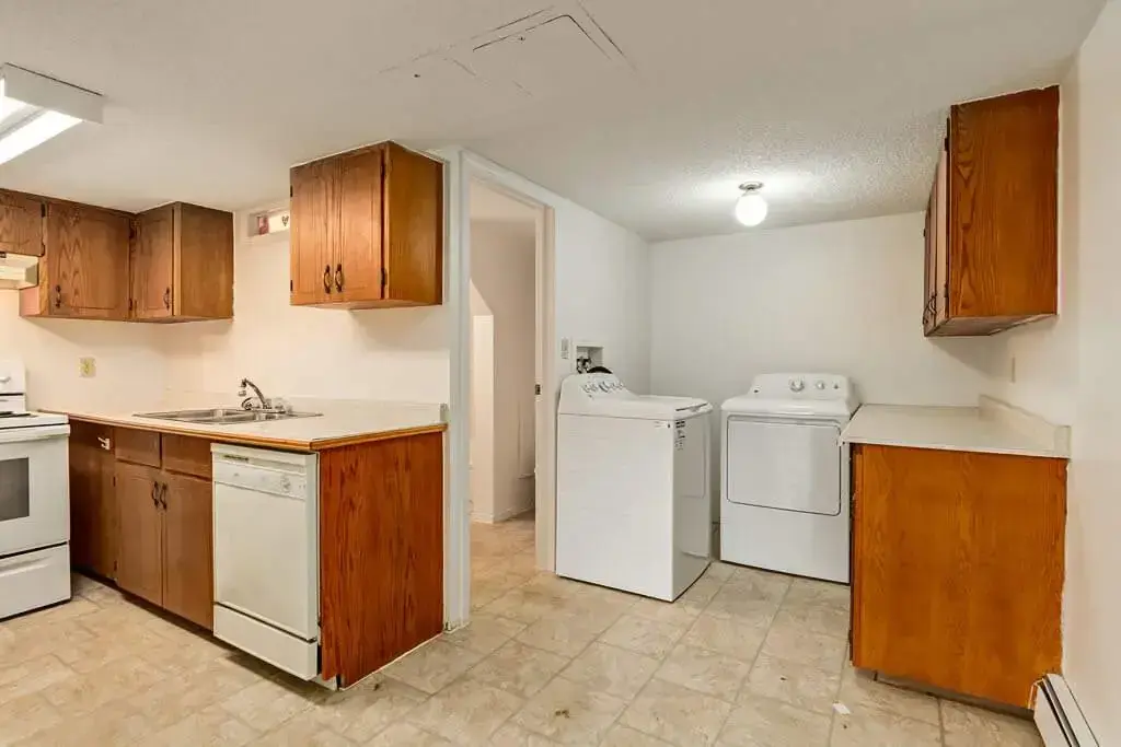 Kitchen and laundry area at Bel-Aire Apartments in Lethbridge.