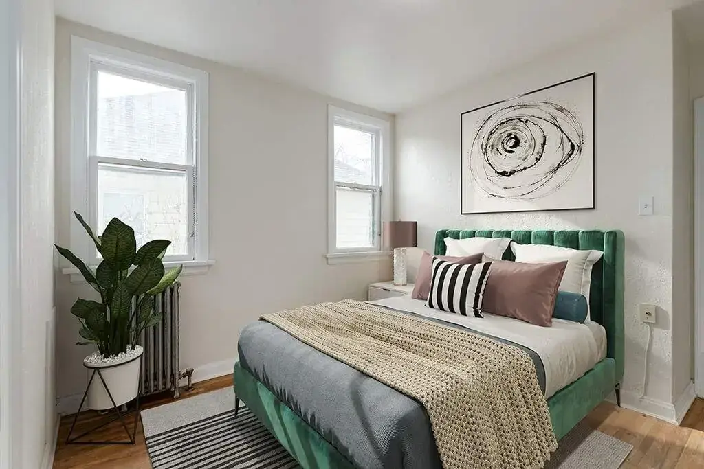 Comfortable and well-sized bedroom at Tudor Manor in Lethbridge.