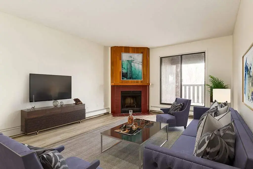 Living room with charming fireplace at Cambridge Court in Lloydminster.