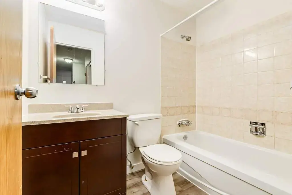 Full bathroom with tub and shower at Cambridge Court in Lloydminster.