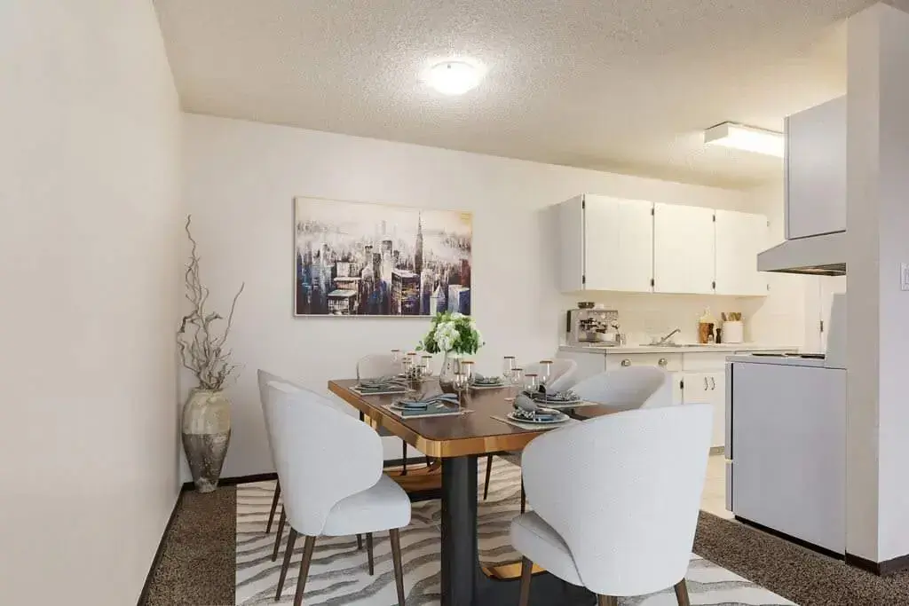 Galley style kitchen and dining area at Hillview Apartments in Medicine Hat.
