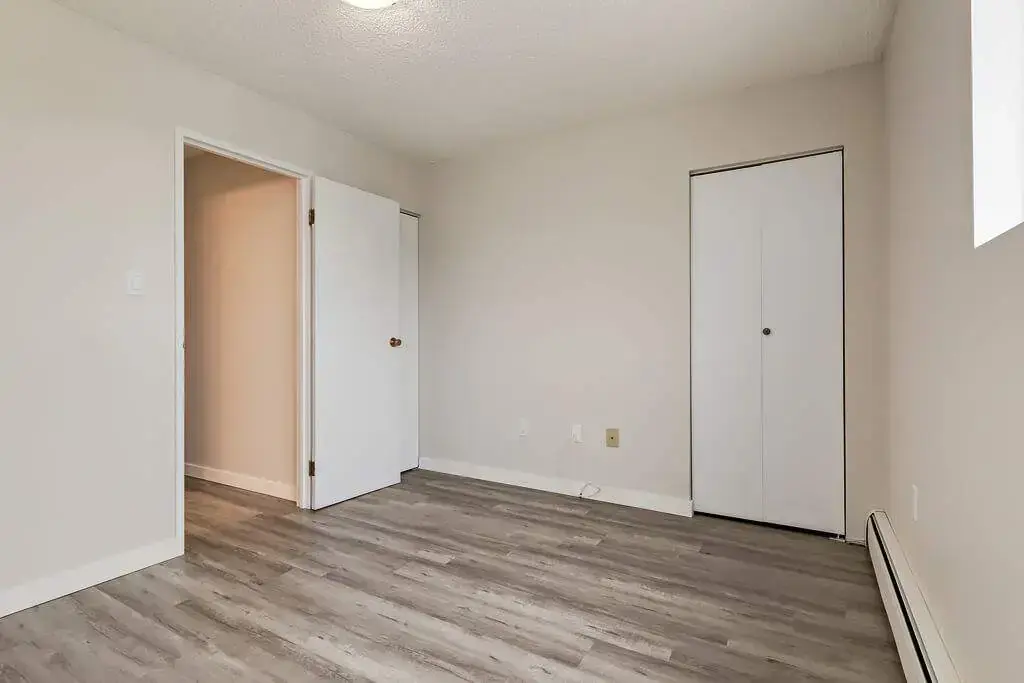 Bright bedroom with comfortable proportions at Hillview Apartments in Medicine Hat.