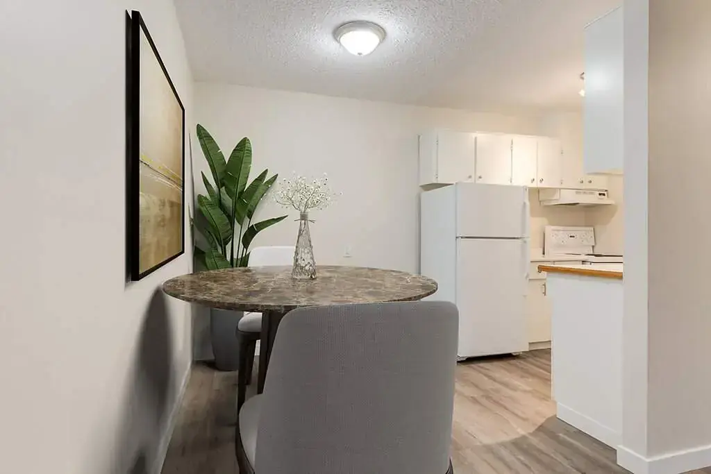 Galley style kitchen with appliances at Forest Gardens in Moose Jaw.