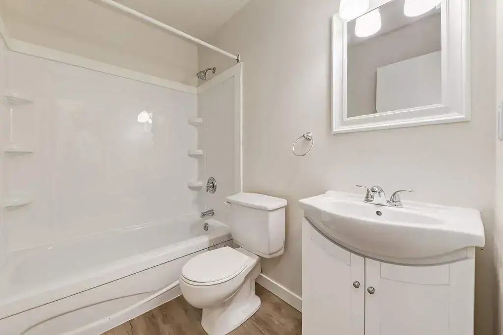 Comfortable full bathroom with tub and shower at Forest Gardens in Moose Jaw.