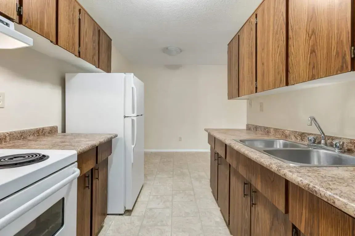 Galley style kitchen and dining area at Forest Gardens in Moose Jaw.