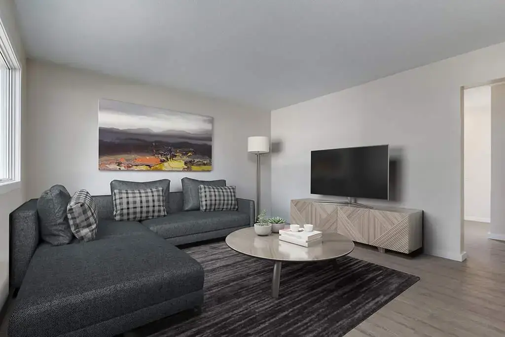 Bright living room with large windows at Manville Bay in Prince Albert.