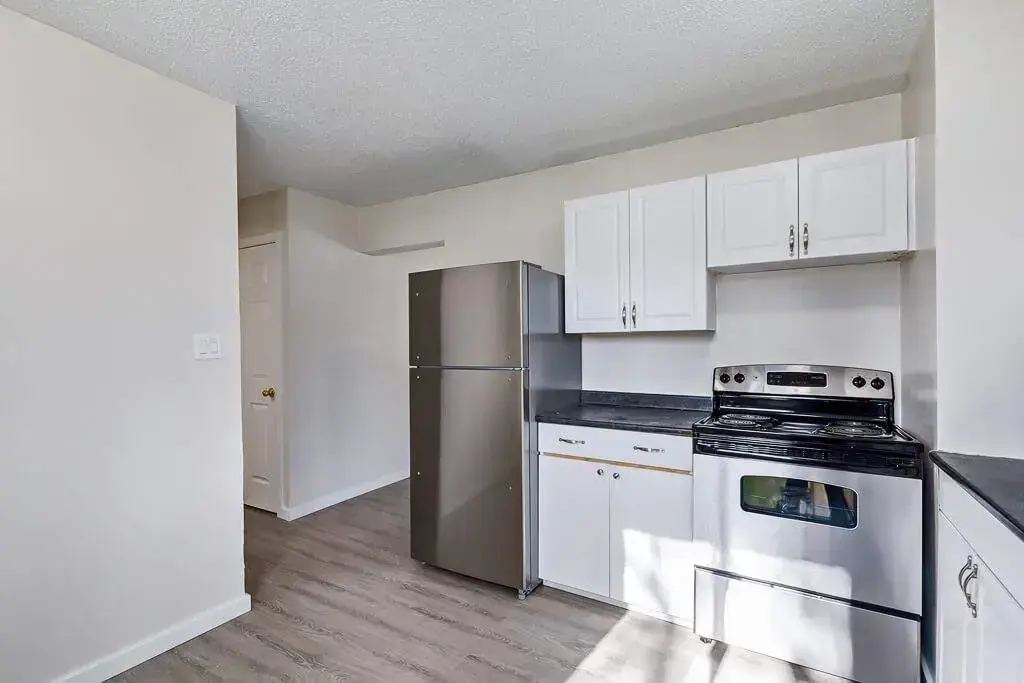 Bright modern kitchen with stainless steel appliances at Manville Bay in Prince Albert.