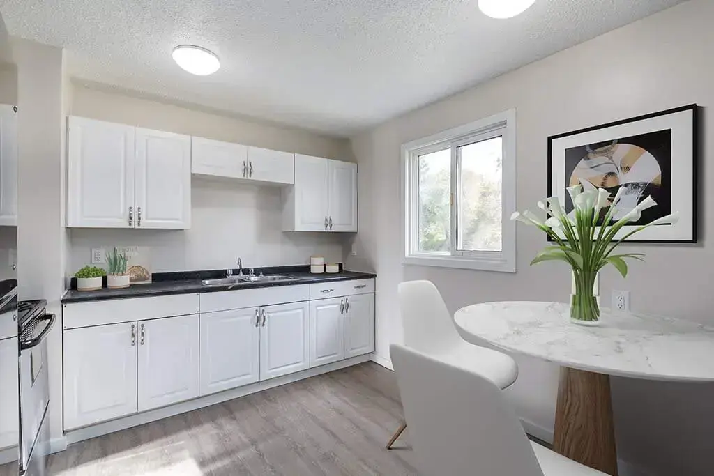 Well-appointed kitchen with stainless steel fridge and stove at Manville Bay in Prince Albert.