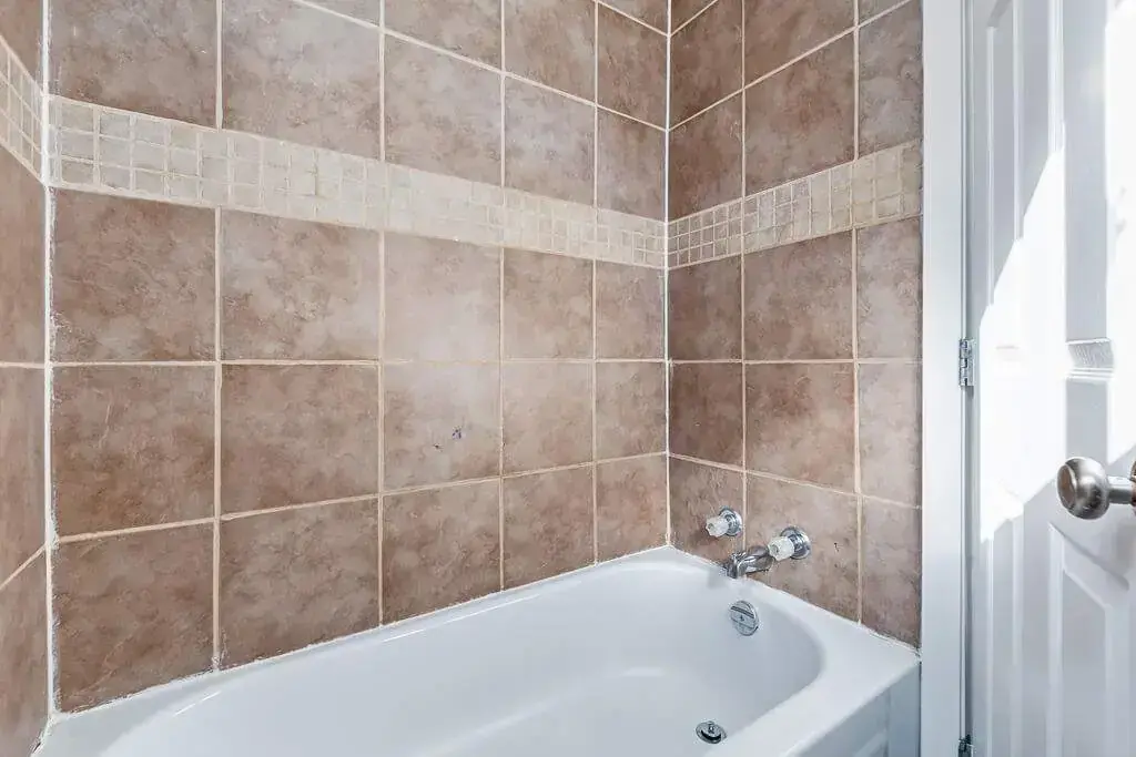 Modern full bathroom with tub and shower at Manville Bay in Prince Albert.