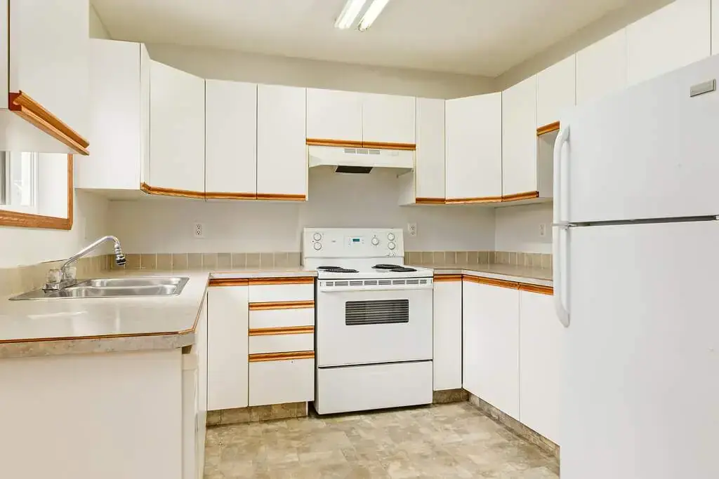 Open-layout kitchen at Kyte Crescent Townhomes in Red Deer.