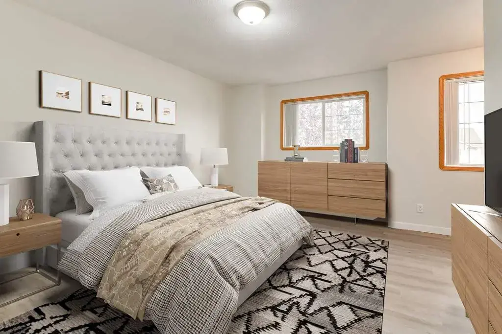Bright bedroom with comfortable proportions at Kyte Crescent Townhomes in Red Deer.