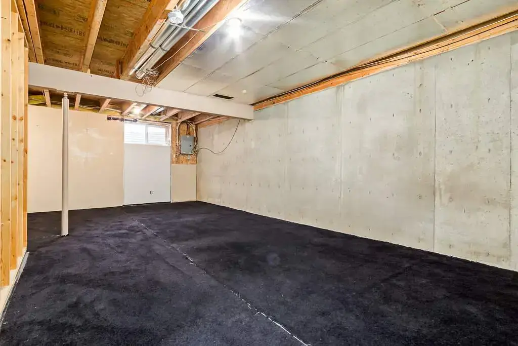 Undeveloped basement at Kyte Crescent Townhomes in Red Deer.
