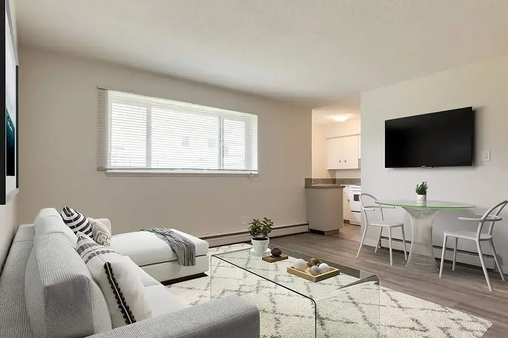 Airy living room with bright windows at Pembroke House in Red Deer.
