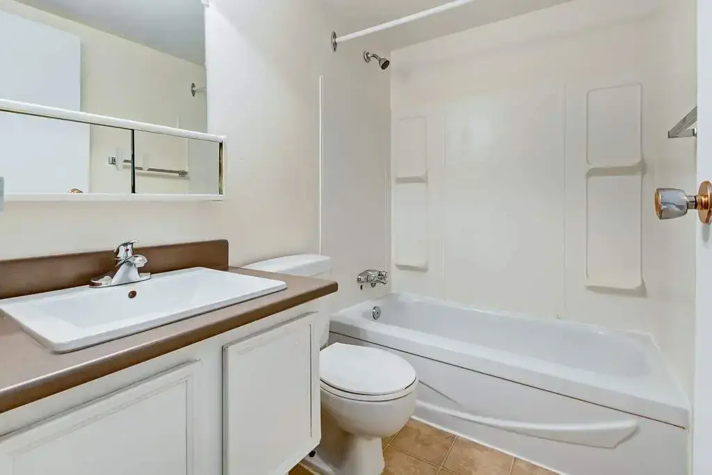 Apartment bathroom with tub and shower at Chancellor Gate in Saskatoon.