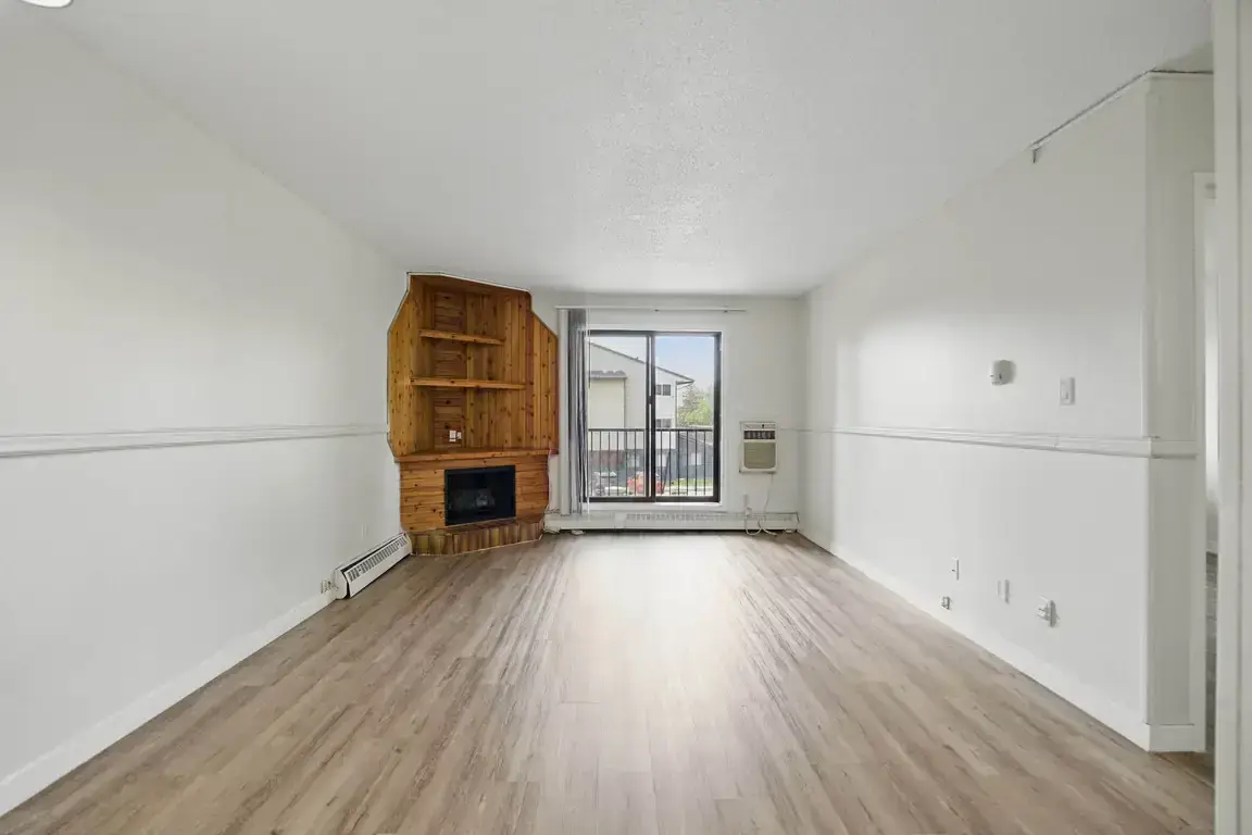 Large living room with open layout at Chancellor Gate in Saskatoon.