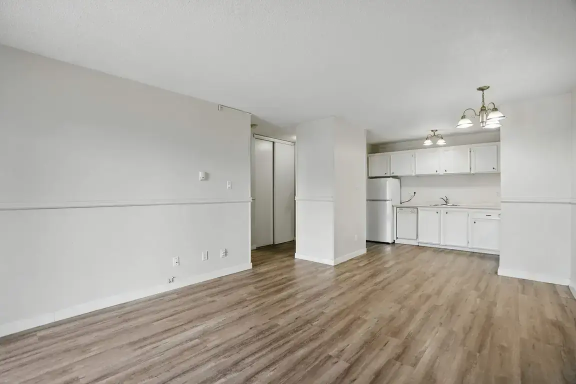 Large living room with open layout at Chancellor Gate in Saskatoon.