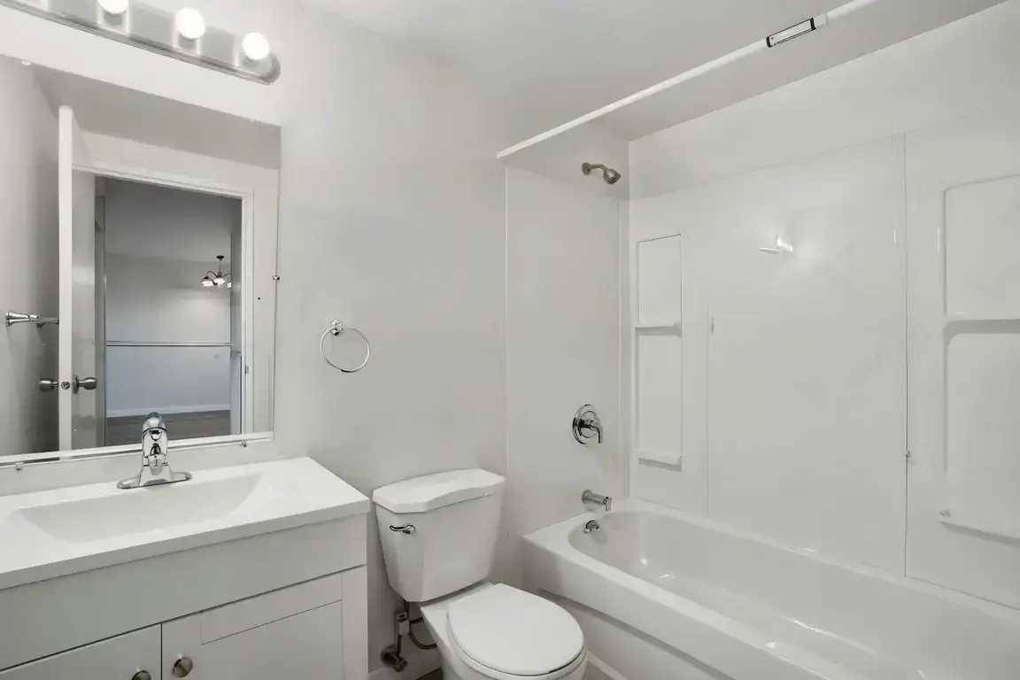 Full bathroom with bathtub and shower combination at Chancellor Gate in Saskatoon.
